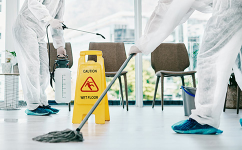 waiting room being disinfected by mop and sprayer