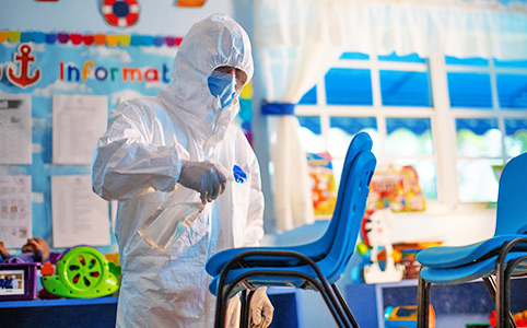 Children's chairs being sprayed with antibacterial solution