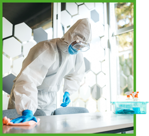 Table being wiped down by man in biohazard gear